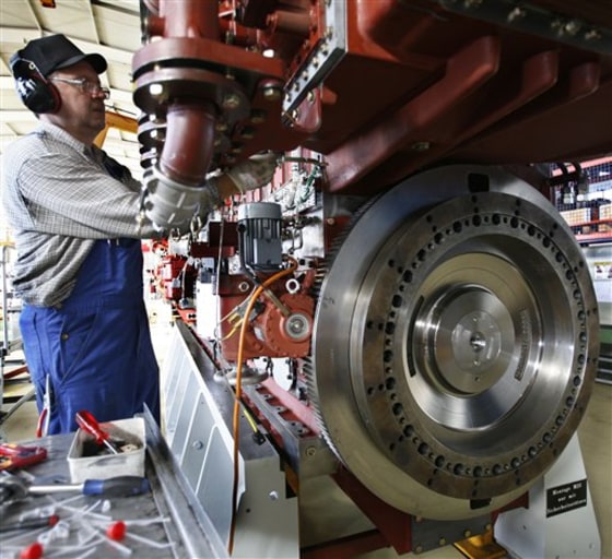 An engine technician works on a vessel engine at the Caterpillar company in Friedrichsort near Kiel, northern Germany. 